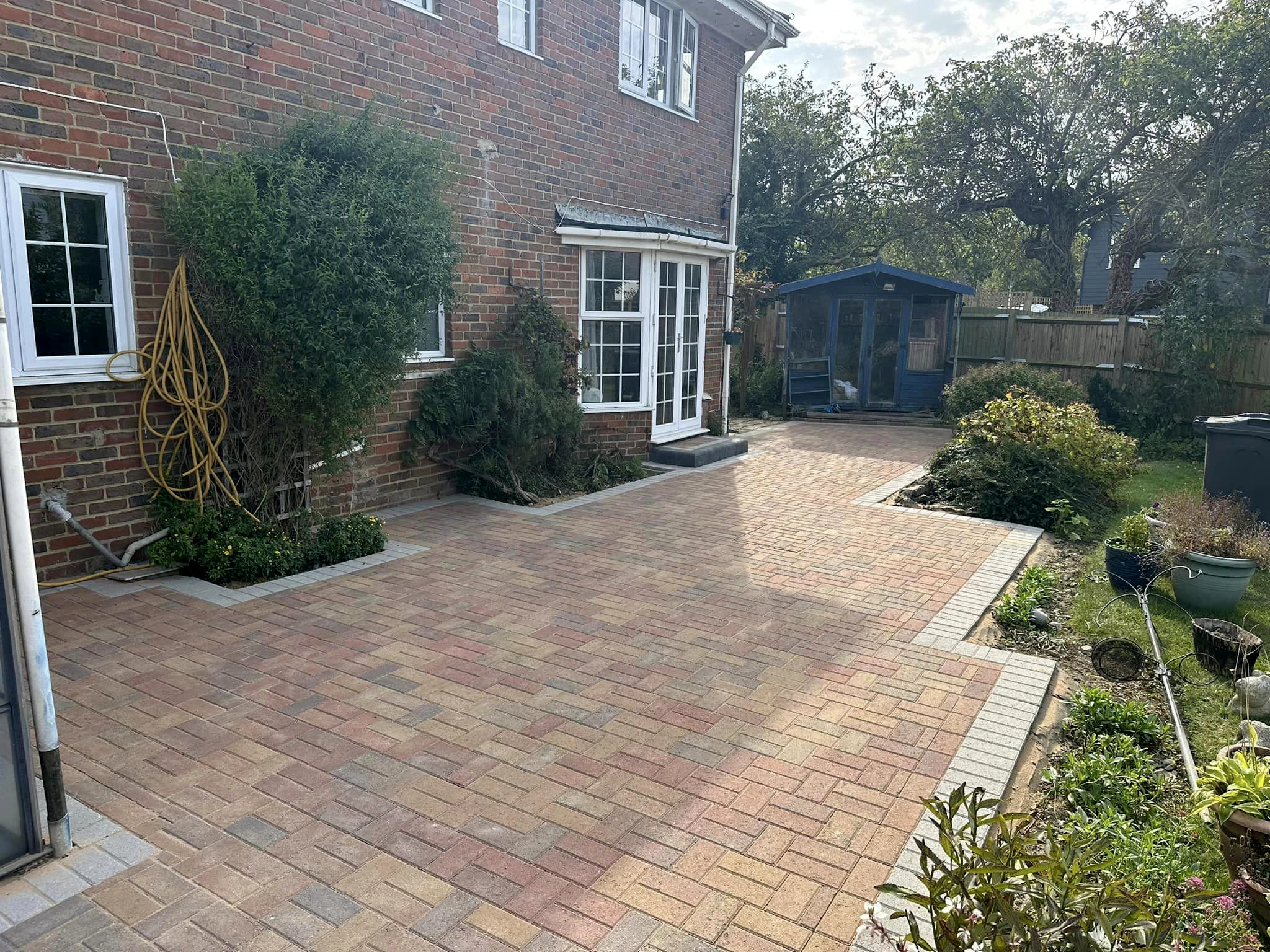 Block paved rear garden patio and path in Kent